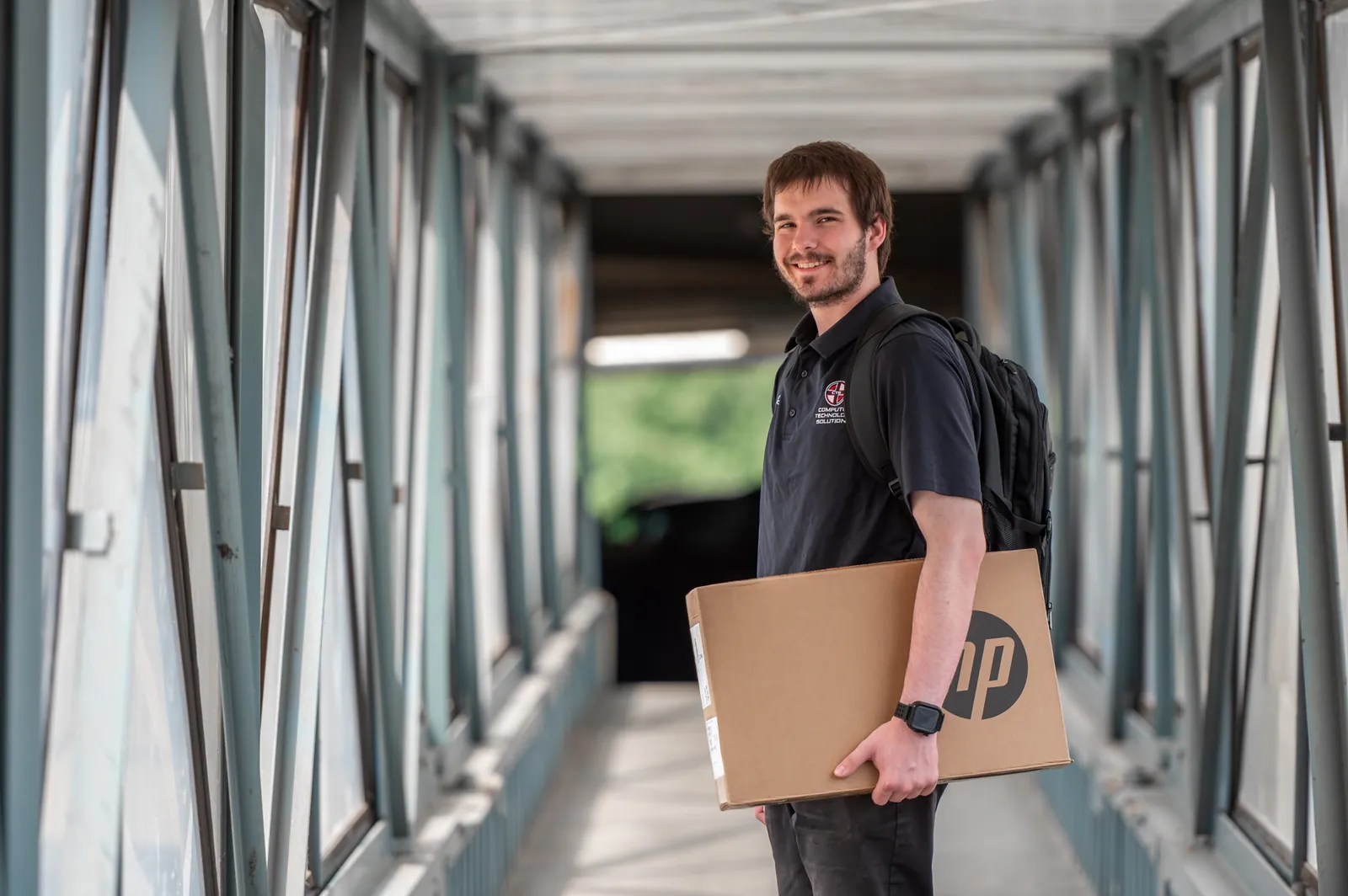 CTS technician delivering a laptop CTS technician delivering a new HP laptop